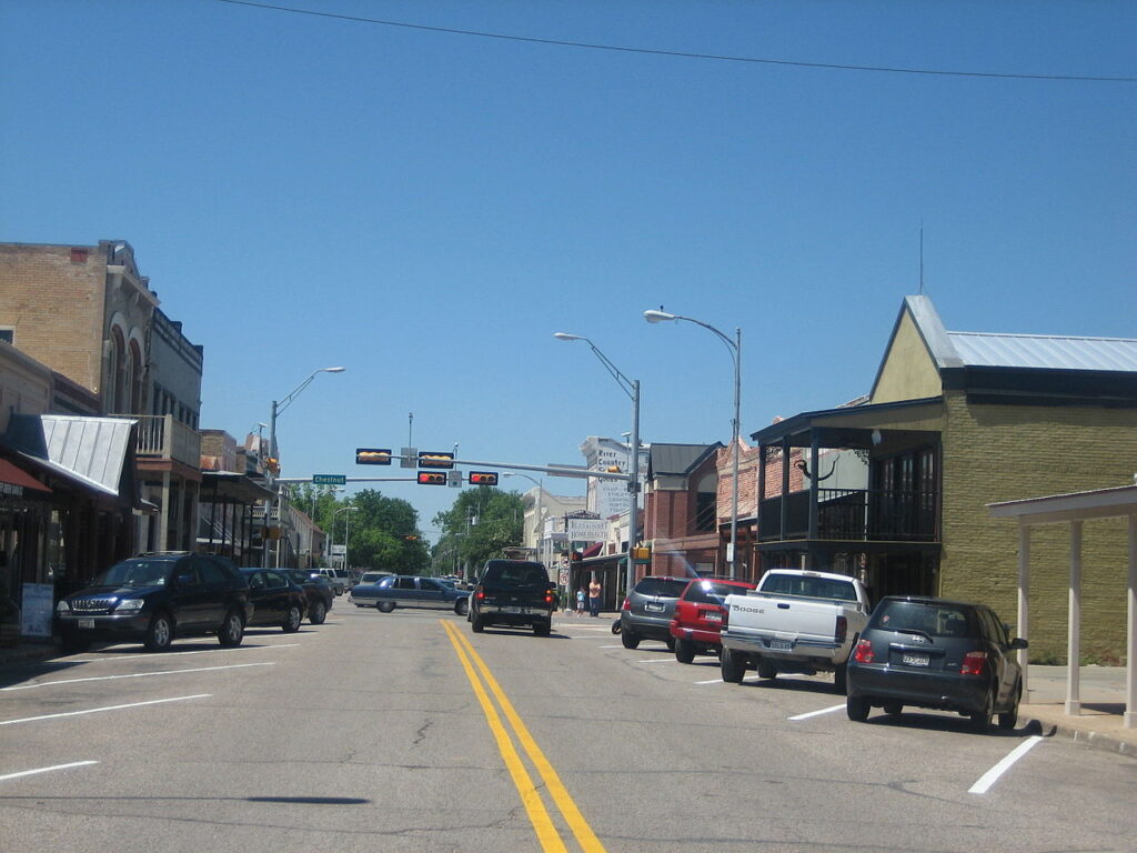 Downtown Main Street in Bastrop, Texas with local storefronts